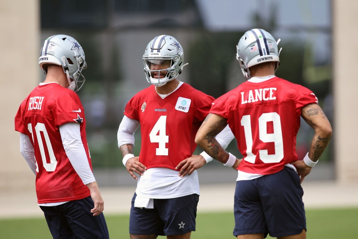 Jun 4, 2024; Frisco, TX, USA;  Dallas Cowboys quarterback Cooper Rush (10) and quarterback Dak Prescott (4) and quarterback Trey Lance (19) talk during practice at the Ford Center at the Star Training Facility in Frisco, Texas. Mandatory Credit: Tim Heitman-Imagn Images