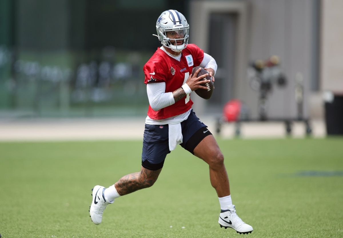 Jun 4, 2024; Frisco, TX, USA;  Dallas Cowboys quarterback Dak Prescott (4) goes through a drill during practice at the Ford Center at the Star Training Facility in Frisco, Texas. Mandatory Credit: Tim Heitman-USA TODAY Sports
