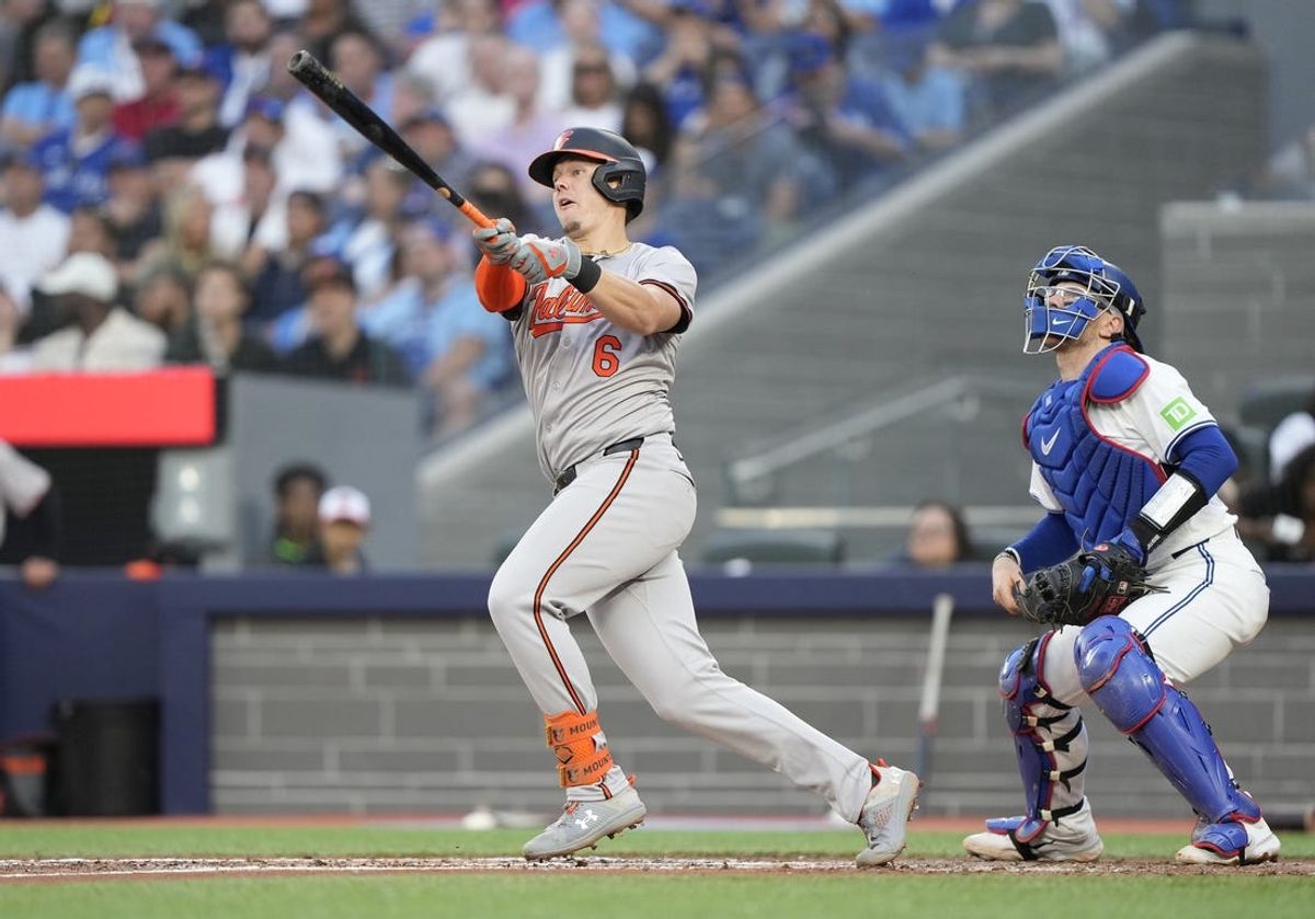 Jun 4, 2024; Toronto, Ontario, CAN; Baltimore Orioles first baseman Ryan Mountcastle (6) hits a three-run home run against the Toronto Blue Jays during the third inning at Rogers Centre. Mandatory Credit: John E. Sokolowski-USA TODAY Sports