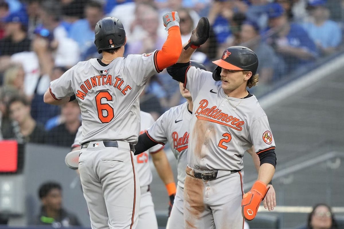 Jun 4, 2024; Toronto, Ontario, CAN;  Baltimore Orioles shortstop Gunnar Henderson (2) congratulates first baseman Ryan Mountcastle (6) on his three-run home run against the Toronto Blue Jays during the third inning at Rogers Centre. Mandatory Credit: John E. Sokolowski-USA TODAY Sports