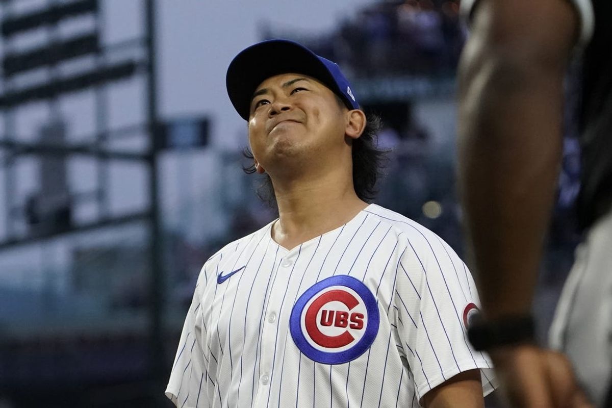 Jun 4, 2024; Chicago, Illinois, USA; Chicago Cubs pitcher Shota Imanaga (18) grimaces after giving up an infield single against the Chicago White Sox during the second inning at Wrigley Field. Mandatory Credit: David Banks-USA TODAY Sports