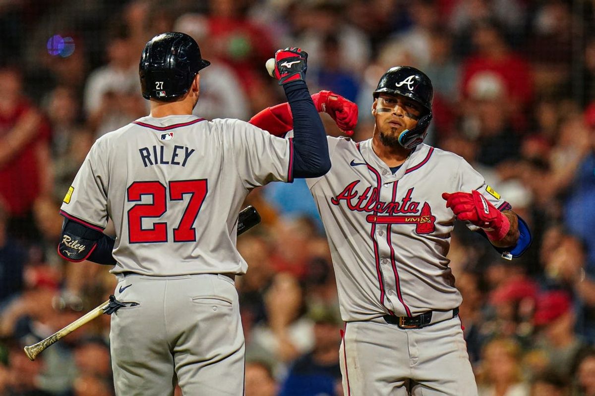 Jun 4, 2024; Boston, Massachusetts, USA; Atlanta Braves shortstop Orlando Arcia (11) is congratulated by third baseman Austin Riley (27) after hitting a home run against the Boston Red Sox in the seventh inning at Fenway Park. Mandatory Credit: David Butler II-USA TODAY Sports