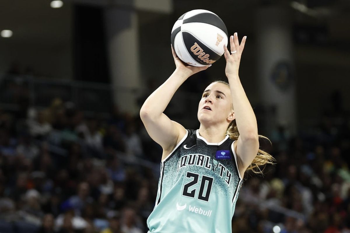 Jun 4, 2024; Chicago, Illinois, USA; New York Liberty guard Sabrina Ionescu (20) shoots against the Chicago Sky during the first half of a WNBA game at Wintrust Arena. Mandatory Credit: Kamil Krzaczynski-USA TODAY Sports