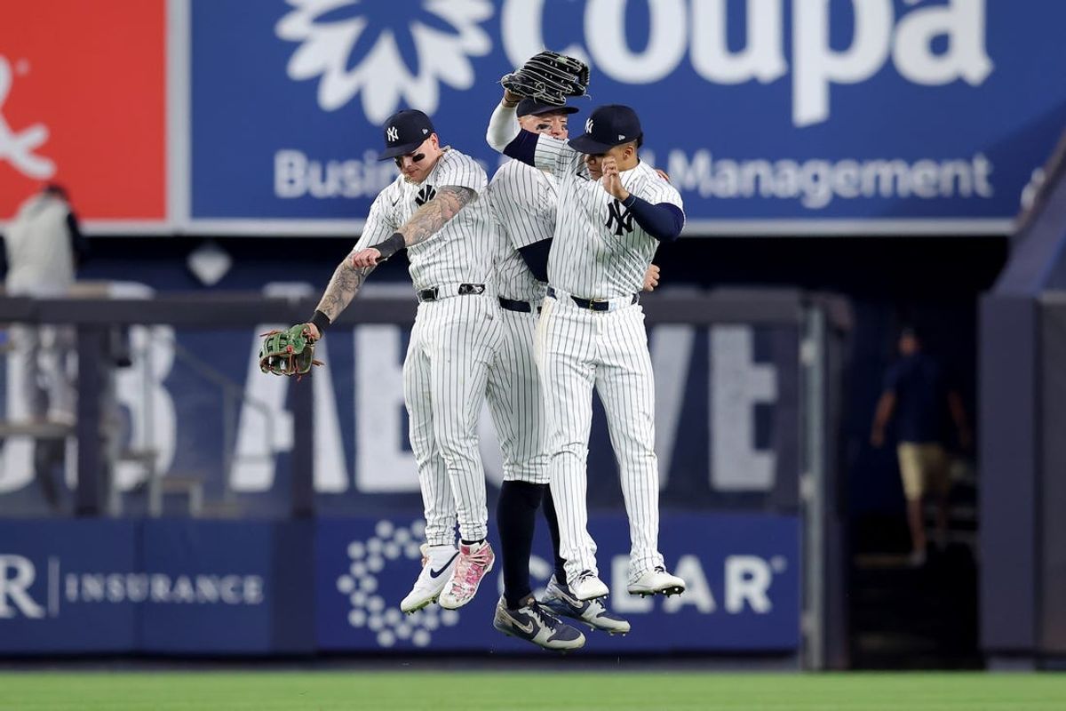 Jun 4, 2024; Bronx, New York, USA; New York Yankees left fielder Alex Verdugo (24) and center fielder Aaron Judge (99) and right fielder Juan Soto (22) celebrate after defeating the Minnesota Twins at Yankee Stadium. Mandatory Credit: Brad Penner-USA TODAY Sports