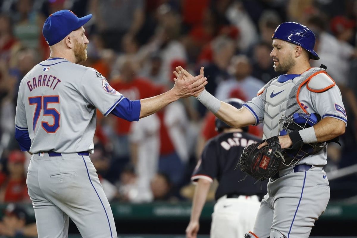 Jun 4, 2024; Washington, District of Columbia, USA; New York Mets pitcher Reed Garrett (75) celebrates with Mets catcher Tomás Nido (3) after their game against the Washington Nationals at Nationals Park. Mandatory Credit: Geoff Burke-USA TODAY Sports
