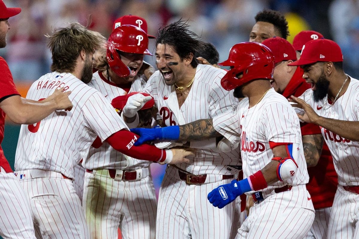 Jun 4, 2024; Philadelphia, Pennsylvania, USA; Philadelphia Phillies outfielder Nick Castellanos (8) celebrates with teammates after hitting a game winning walk off RBI single during the tenth inning against the Milwaukee Brewers at Citizens Bank Park. Mandatory Credit: Bill Streicher-USA TODAY Sports