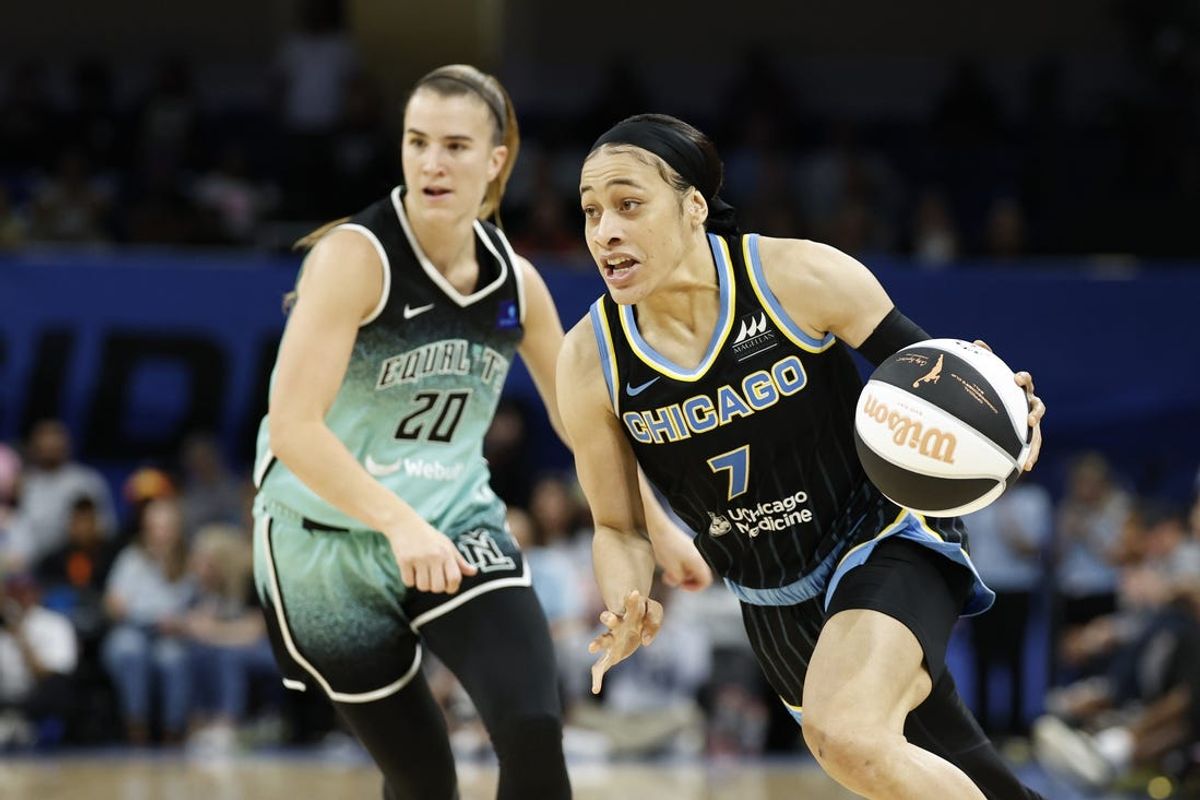 Jun 4, 2024; Chicago, Illinois, USA; Chicago Sky guard Chennedy Carter (7) drives to the basket against New York Liberty guard Sabrina Ionescu (20) during the second half of a WNBA game at Wintrust Arena. Mandatory Credit: Kamil Krzaczynski-USA TODAY Sports