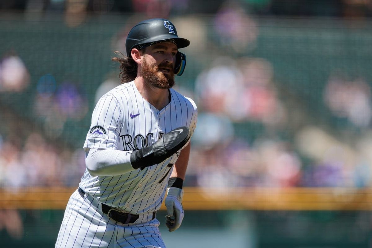 Jun 5, 2024; Denver, Colorado, USA; Colorado Rockies second base Brendan Rodgers (7) runs home to score during the first inning against the Cincinnati Reds at Coors Field. Mandatory Credit: Andrew Wevers-USA TODAY Sports