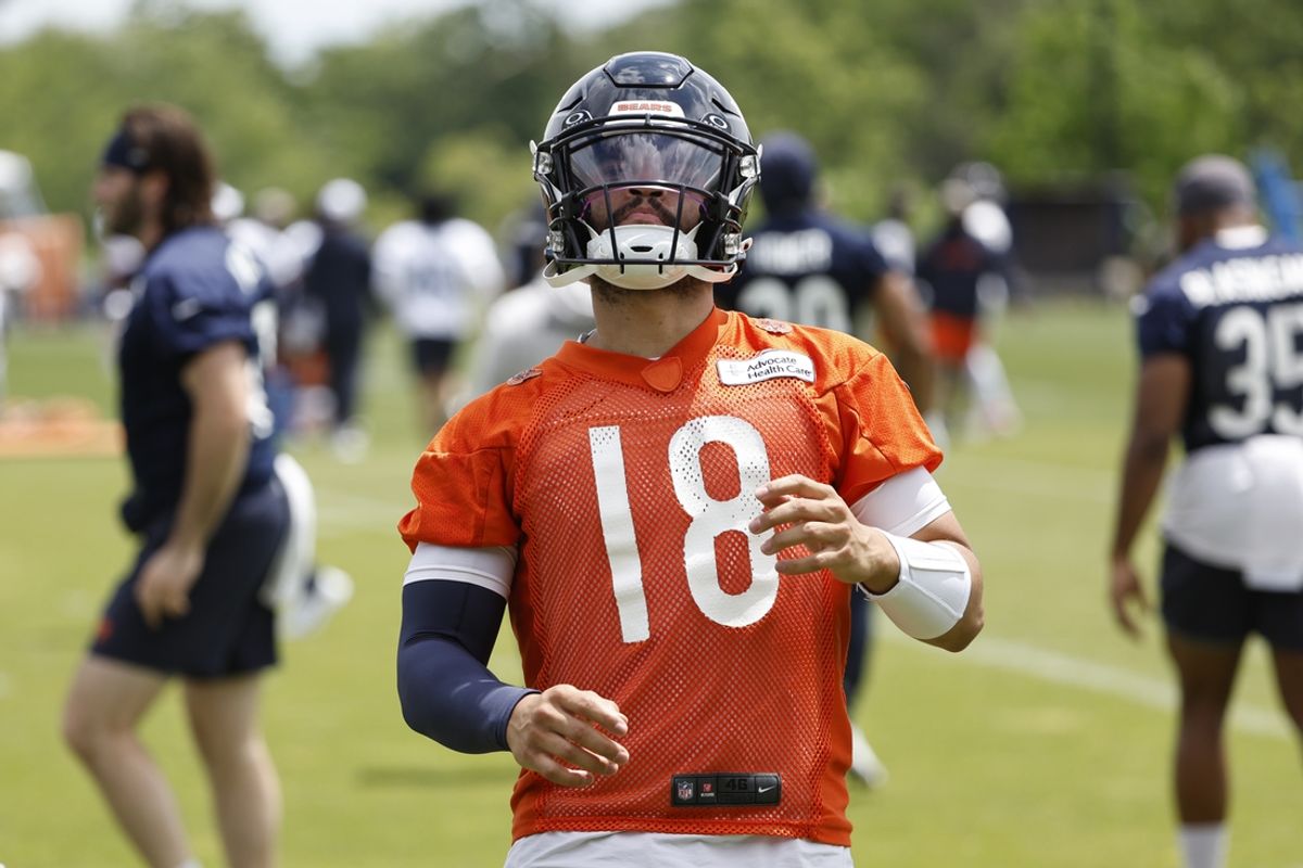 Jun 5, 2024; Lake Forest, IL, USA; Chicago Bears quarterback Caleb Williams (18) warms up during the team's minicamp at Halas Hall. Mandatory Credit: Kamil Krzaczynski-USA TODAY Sports