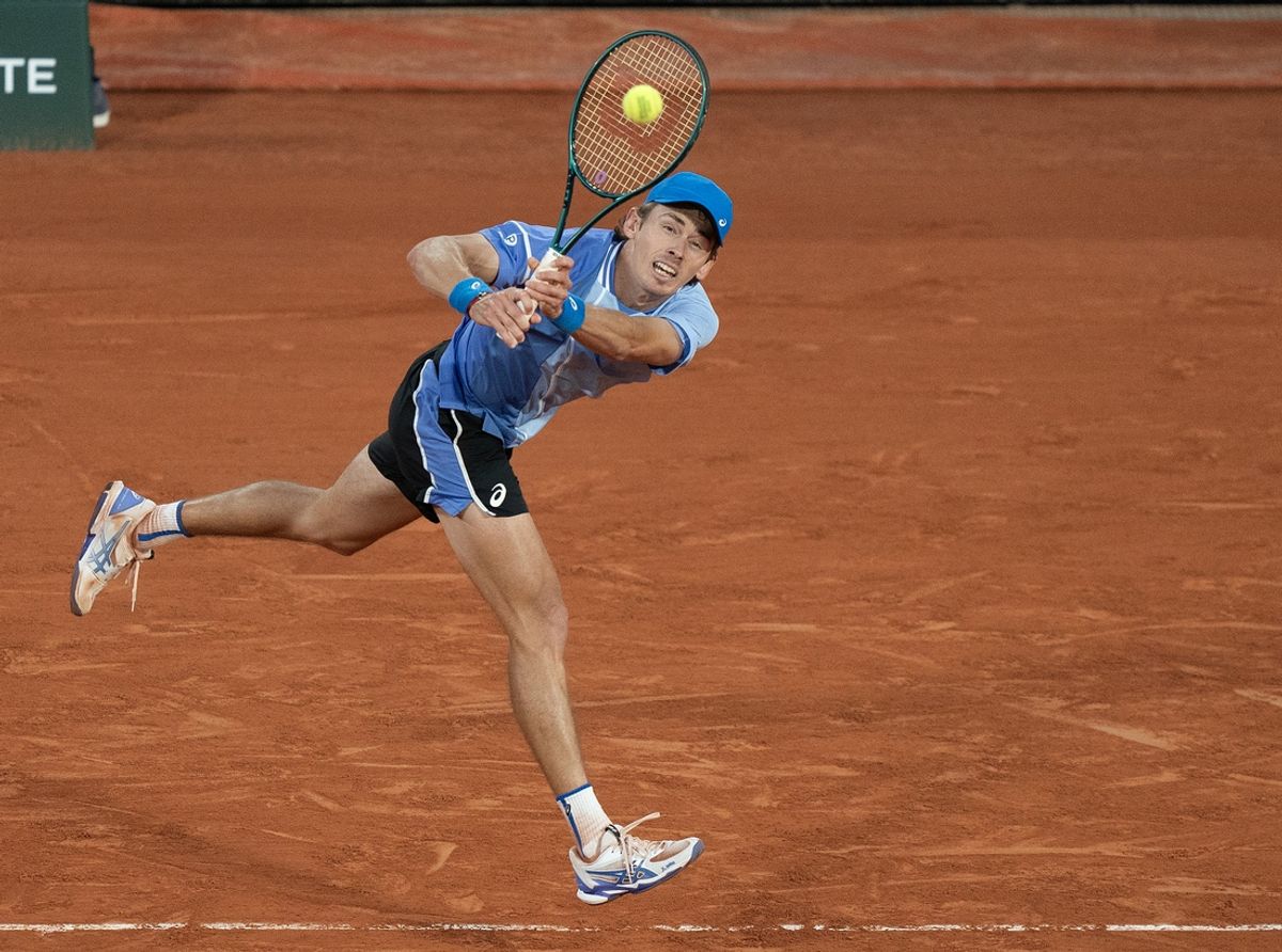 Jun 5, 2024; Paris, France; Alex De Minaur of Australia returns a shot during his match against Alexander Zverev of Germany on day 11 of Roland Garros at Stade Roland Garros. Mandatory Credit: Susan Mullane-USA TODAY Sports