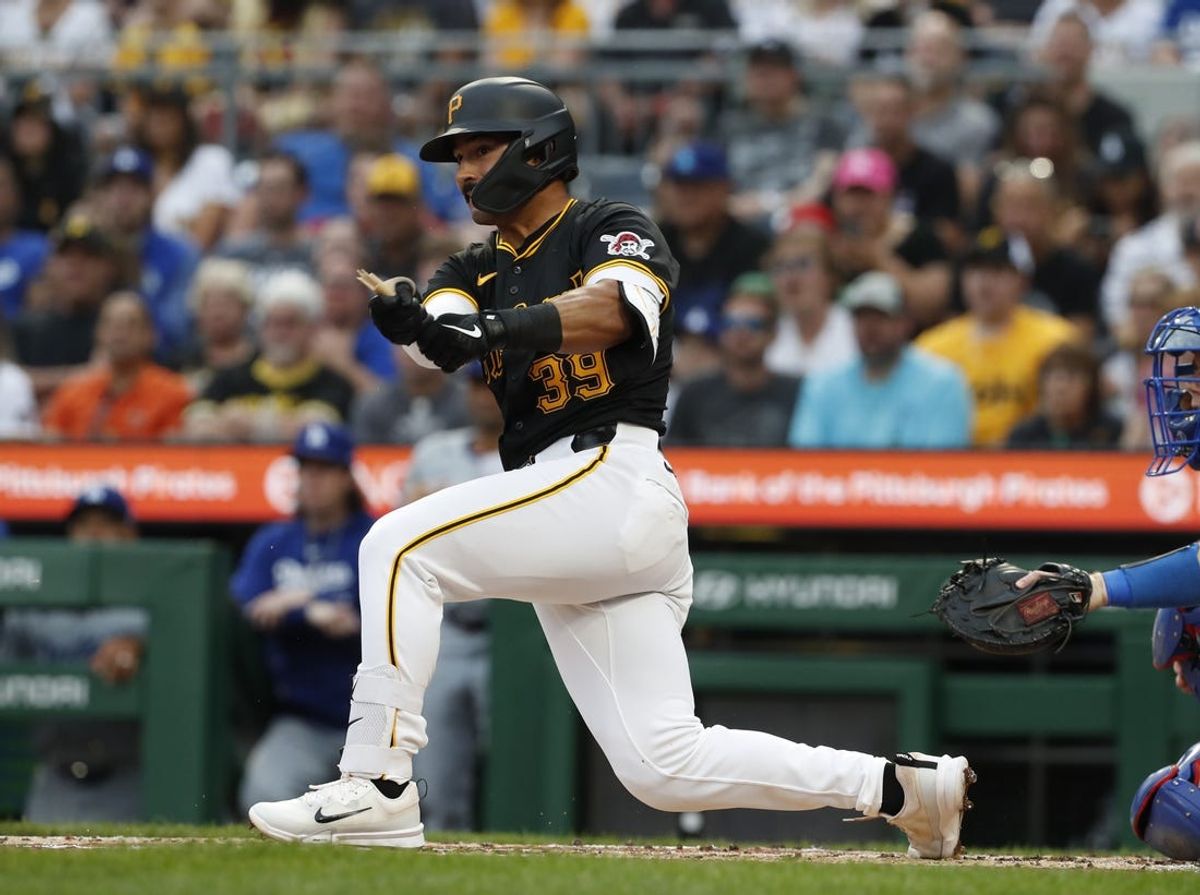 Jun 5, 2024; Pittsburgh, Pennsylvania, USA;  Pittsburgh Pirates shortstop Nick Gonzales (39) hits a two run double against the Los Angeles Dodgers during the second inning at PNC Park. Mandatory Credit: Charles LeClaire-USA TODAY Sports