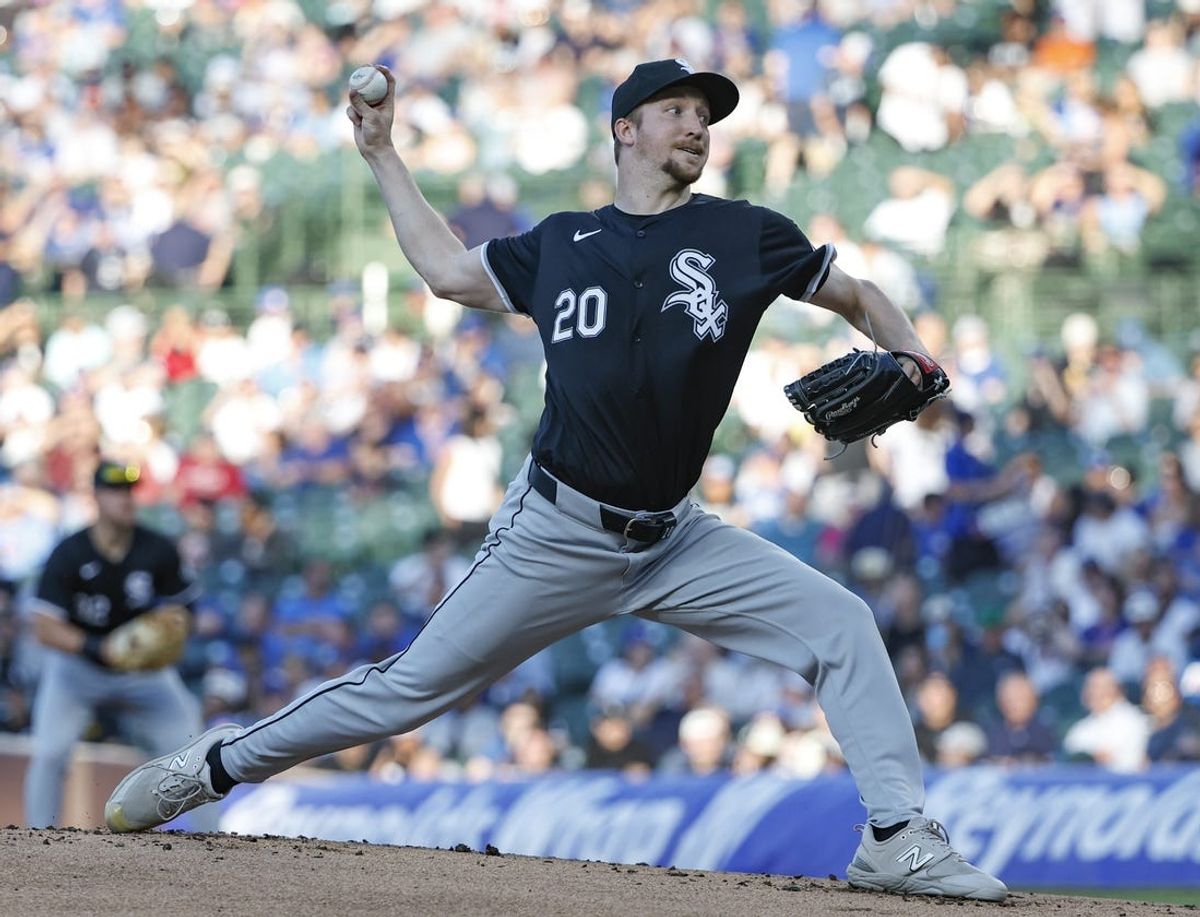 Jun 5, 2024; Chicago, Illinois, USA; Chicago White Sox starting pitcher Erick Fedde (20) delivers a pitch against the Chicago Cubs during the first inning at Wrigley Field. Mandatory Credit: Kamil Krzaczynski-USA TODAY Sports