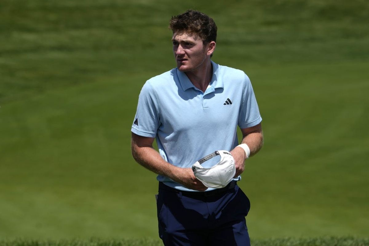 Jun 6, 2024; Dublin, Ohio, USA; Nick Dunlap looks on from the 18th green during the first round of the Memorial Tournament at Muirfield Village Golf Club. Mandatory Credit: Barbara J. Perenic-USA TODAY Sports