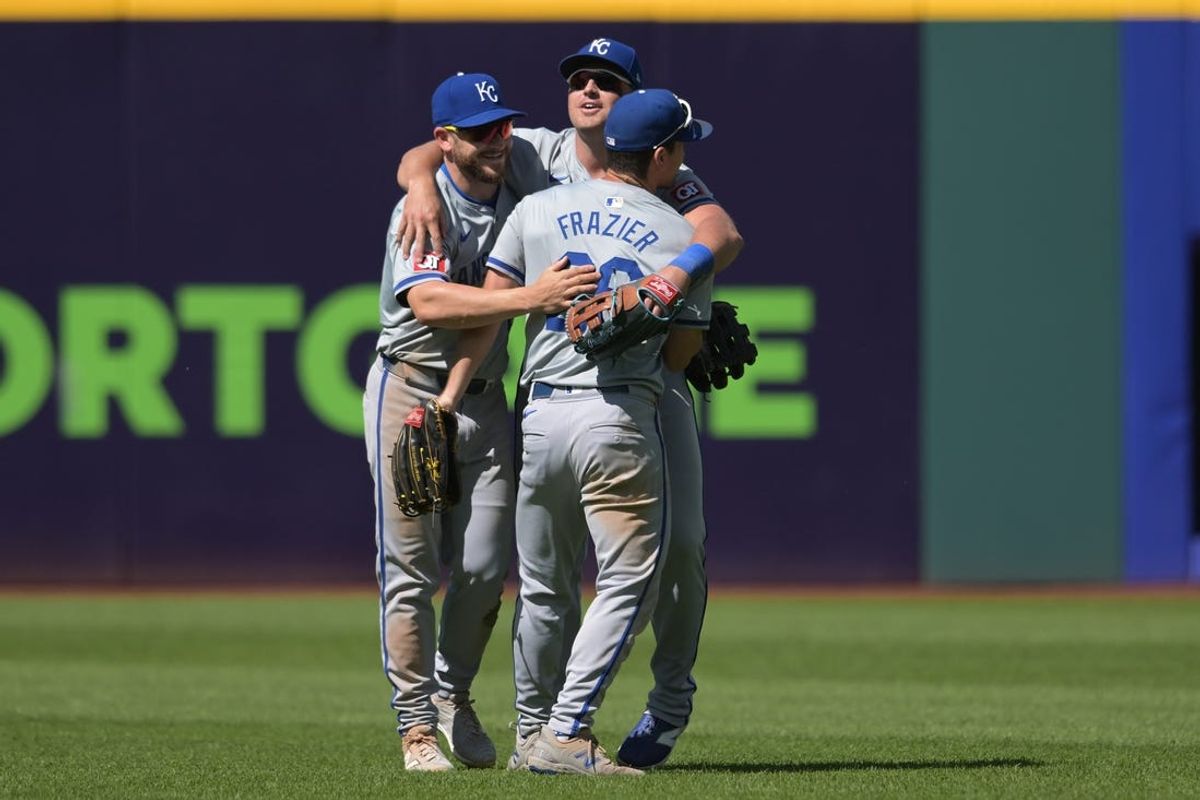 Jun 6, 2024; Cleveland, Ohio, USA; Kansas City Royals left fielder Adam Frazier (26) and center fielder Kyle Isbel (28) and right fielder Hunter Renfroe (16) celebrate after the Royals beat the Cleveland Guardians at Progressive Field. Mandatory Credit: Ken Blaze-USA TODAY Sports