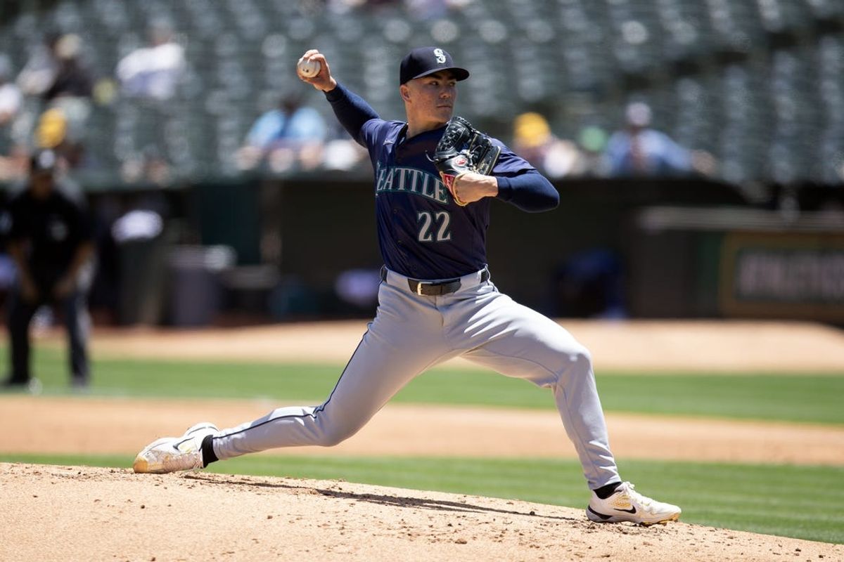 Jun 6, 2024; Oakland, California, USA; Seattle Mariners starting pitcher Bryan Woo (22) delivers a pitch against the Oakland Athletics during the second inning at Oakland-Alameda County Coliseum. Mandatory Credit: D. Ross Cameron-USA TODAY Sports
