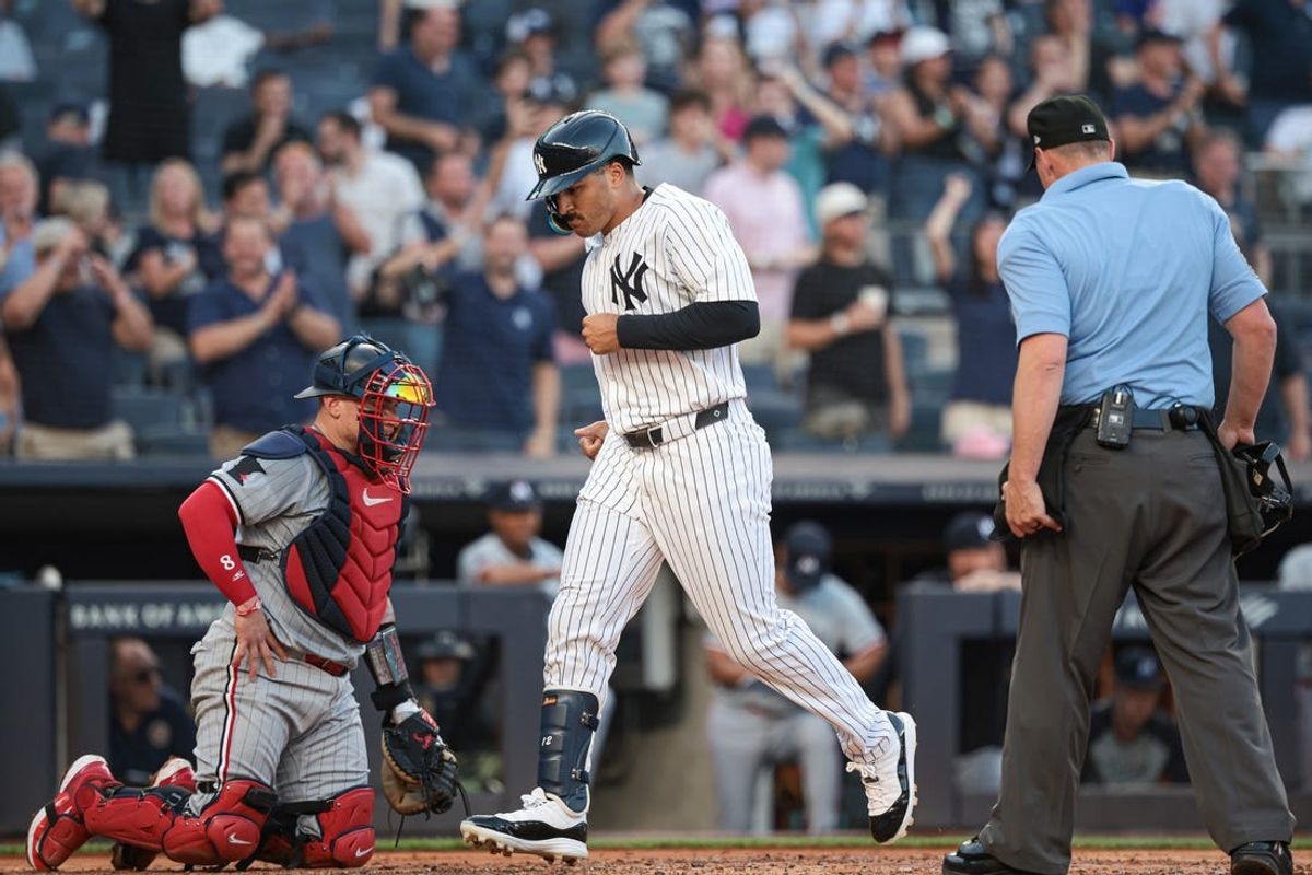 Jun 6, 2024; Bronx, New York, USA; New York Yankees center fielder Trent Grisham (12) scores after hitting a solo home run during the second inning against the Minnesota Twins at Yankee Stadium. Mandatory Credit: Vincent Carchietta-USA TODAY Sports