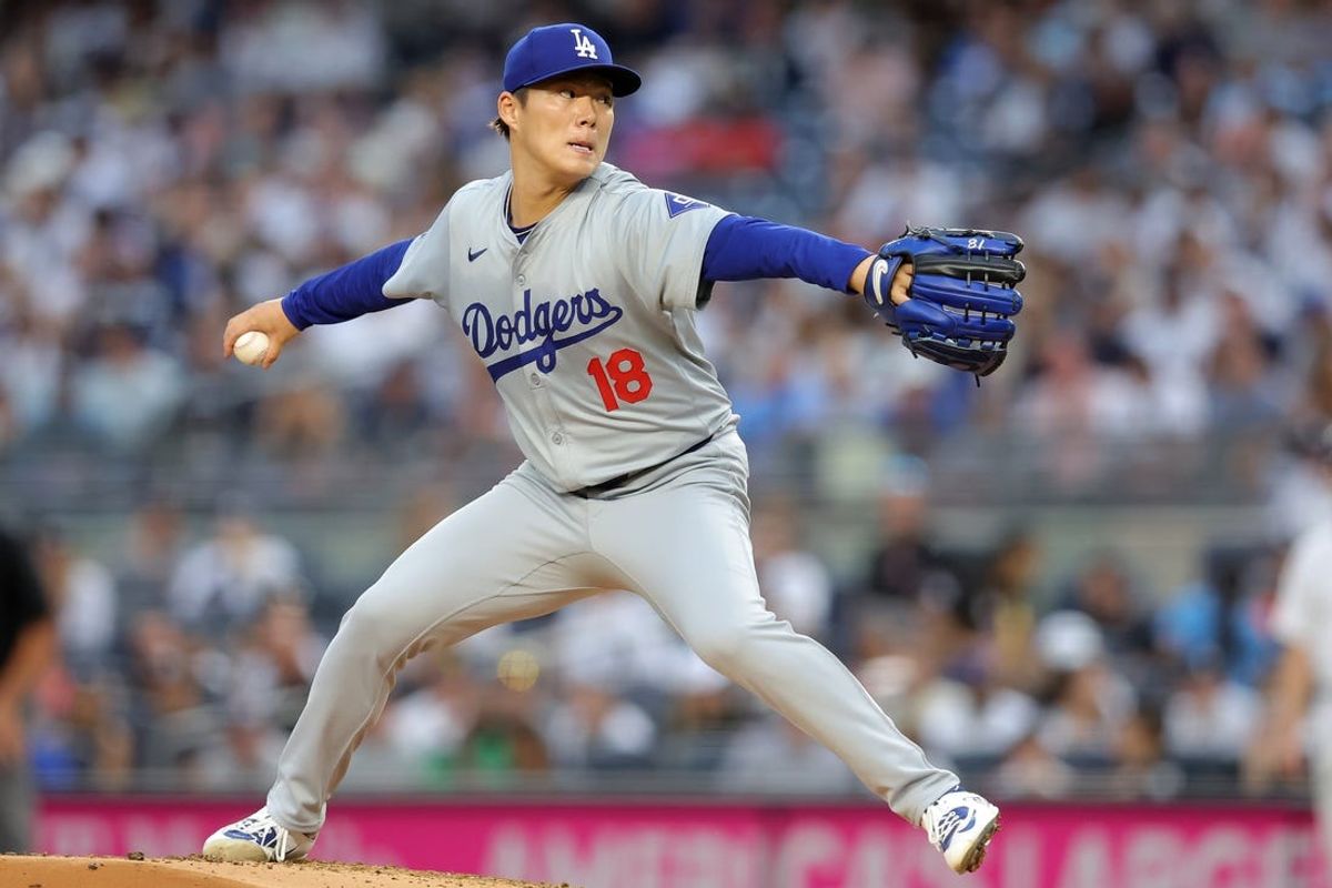 Jun 7, 2024; Bronx, New York, USA; Los Angeles Dodgers starting pitcher Yoshinobu Yamamoto (18) pitches against the New York Yankees during the first inning at Yankee Stadium. Mandatory Credit: Brad Penner-USA TODAY Sports