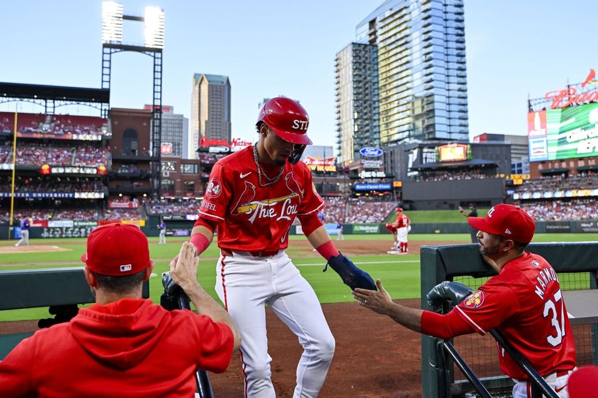 Jun 7, 2024; St. Louis, Missouri, USA;  St. Louis Cardinals shortstop Masyn Winn (0) is congratulated by bench coach Daniel Descalso (left) and manager Oliver Marmol (right) after scoring against the Colorado Rockies during the second inning at Busch Stadium. Mandatory Credit: Jeff Curry-USA TODAY Sports