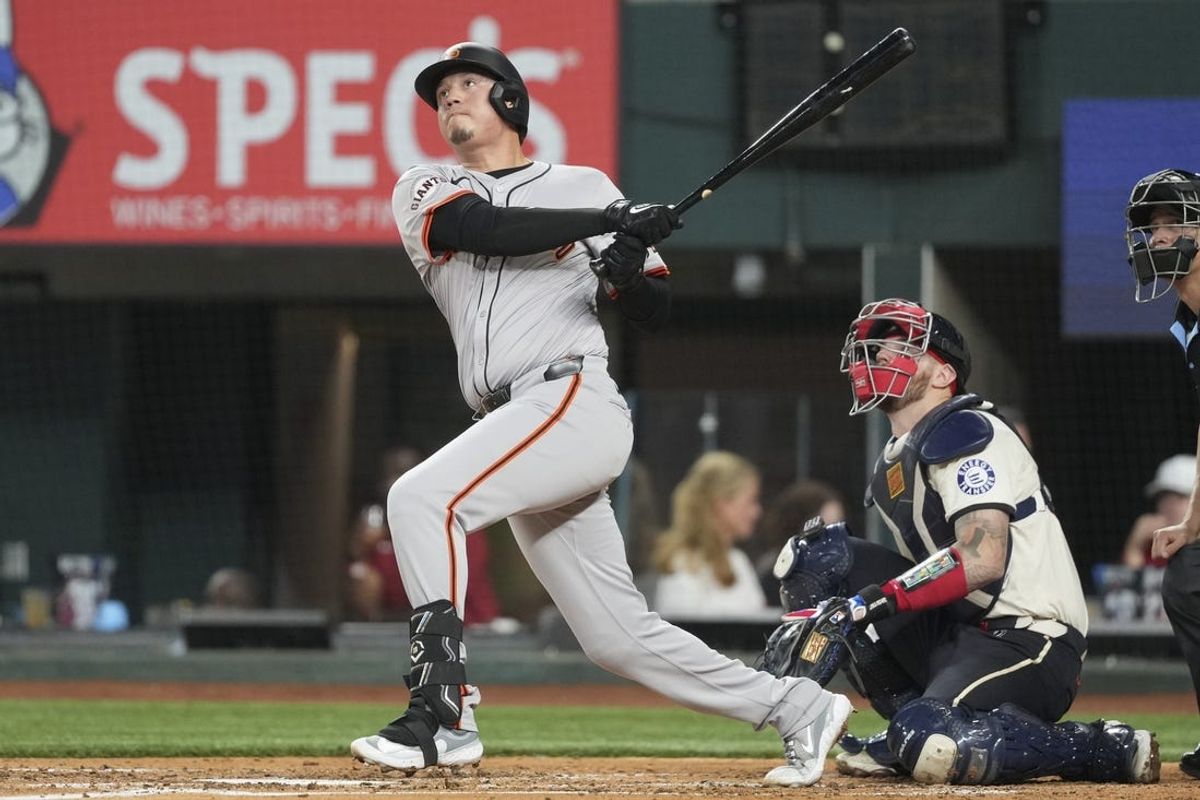 Jun 7, 2024; Arlington, Texas, USA; San Francisco Giants first baseman Wilmer Flores (41) follows through on his home run against the Texas Rangers during the fourth inning at Globe Life Field. Mandatory Credit: Jim Cowsert-USA TODAY Sports