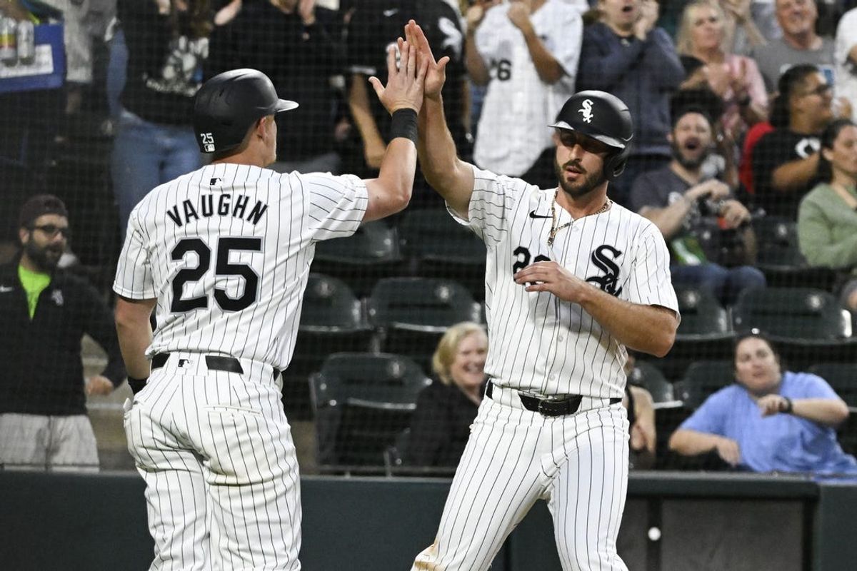 Jun 7, 2024; Chicago, Illinois, USA;  Chicago White Sox first base Andrew Vaughn (25) and shortstop Paul DeJong (29) high five after they  score against the Boston Red Sox during the fourth inning at Guaranteed Rate Field. Mandatory Credit: Matt Marton-USA TODAY Sports