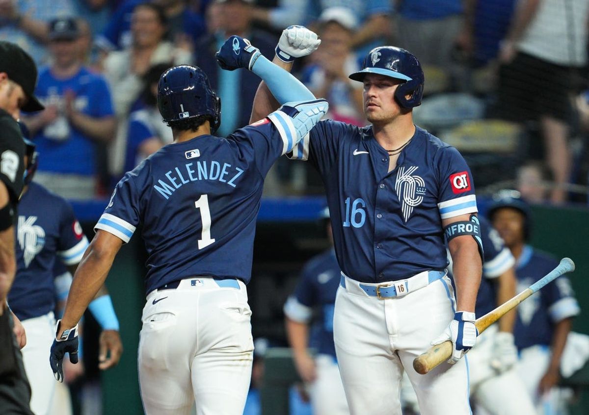 Jun 7, 2024; Kansas City, Missouri, USA; Kansas City Royals right fielder Hunter Renfroe (16) congratulates left fielder MJ Melendez (1) after hitting a home run during the fourth inning at Kauffman Stadium. Mandatory Credit: Jay Biggerstaff-USA TODAY Sports