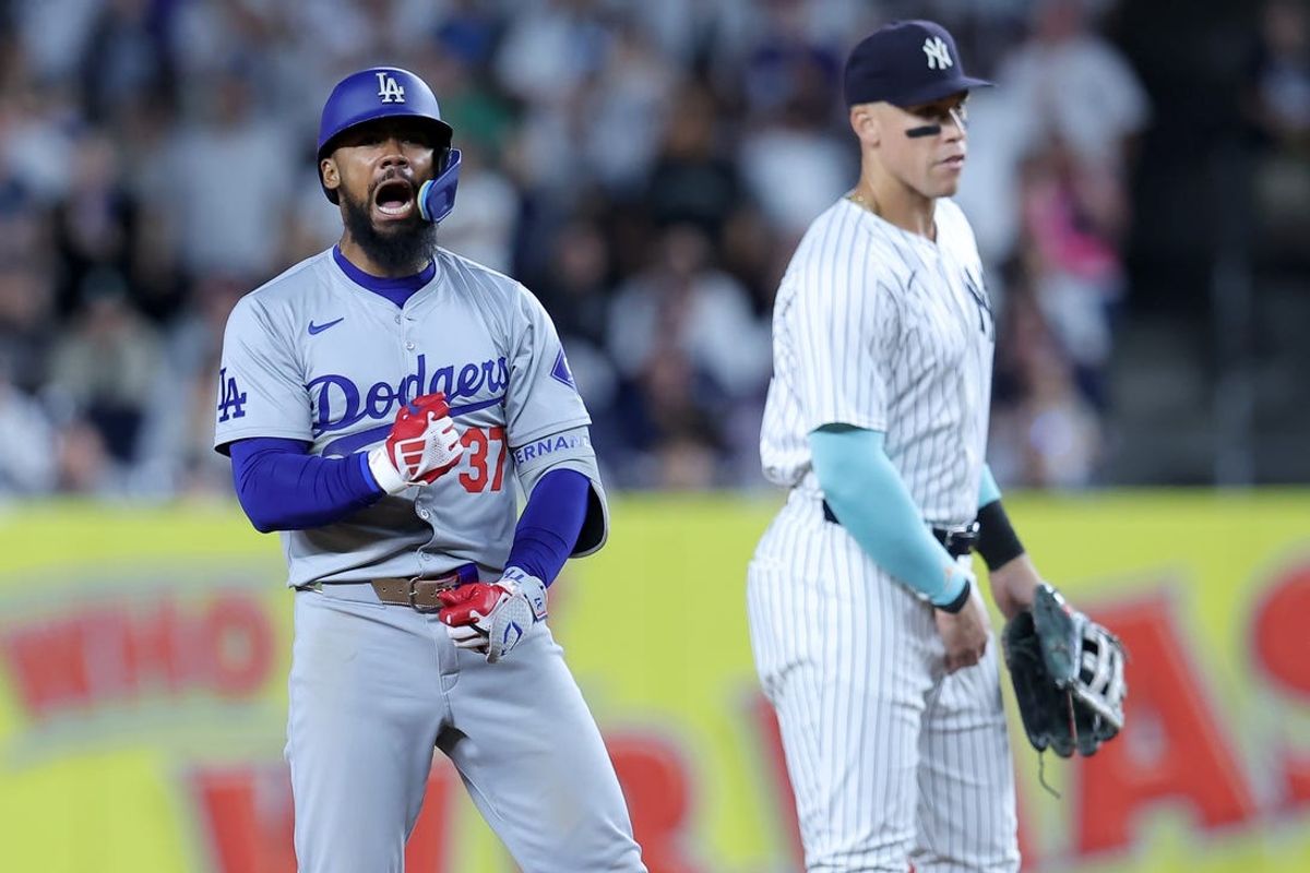 Jun 7, 2024; Bronx, New York, USA; Los Angeles Dodgers left fielder Teoscar Hernandez (37) reacts after his two run double against the New York Yankees during the eleventh inning at Yankee Stadium. Mandatory Credit: Brad Penner-USA TODAY Sports