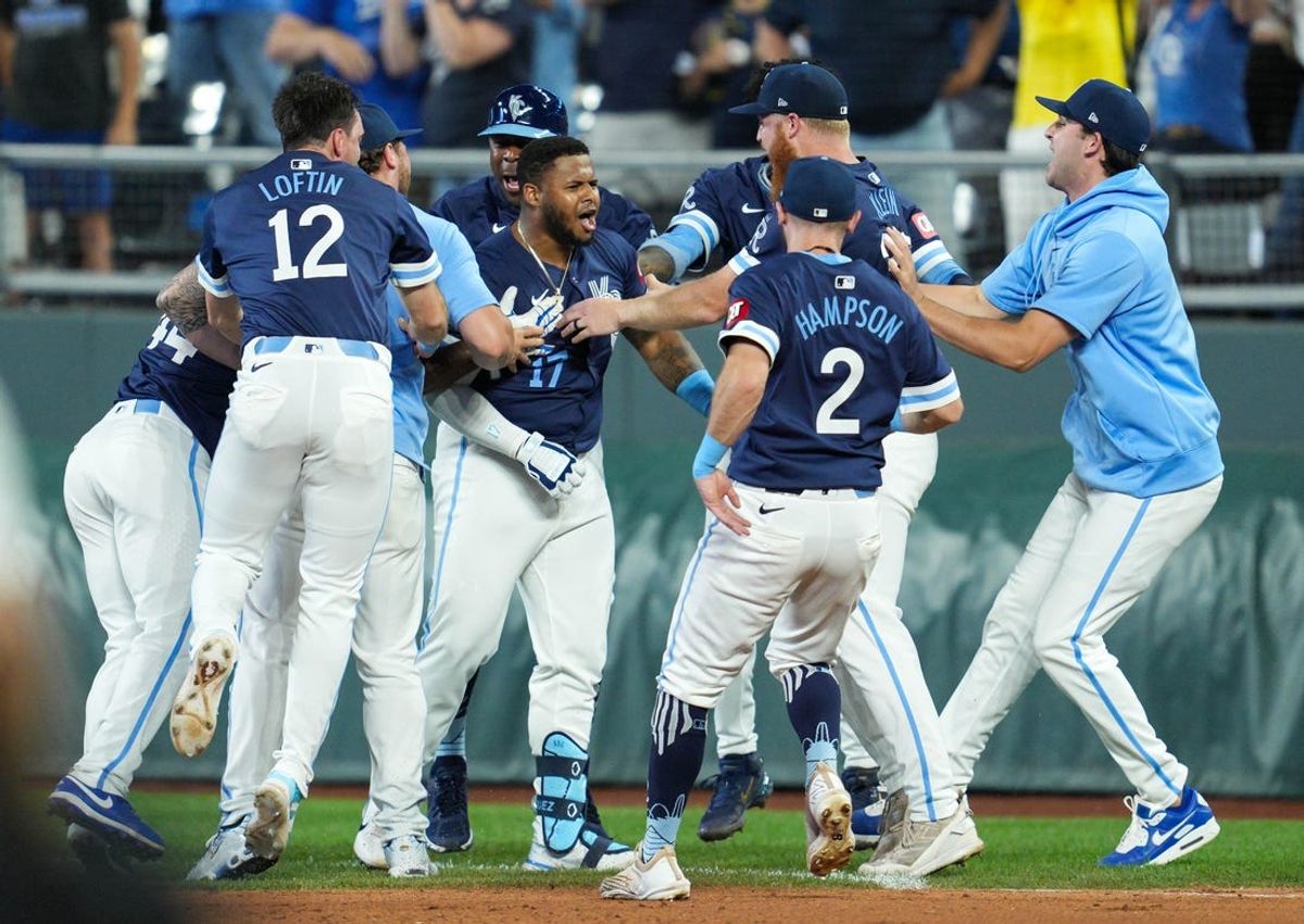 Jun 7, 2024; Kansas City, Missouri, USA; Kansas City Royals designated hitter Nelson Velazquez (17) celebrates with teammates after hitting into a fielder’s choice to defeat the Seattle Mariners at Kauffman Stadium. Mandatory Credit: Jay Biggerstaff-USA TODAY Sports