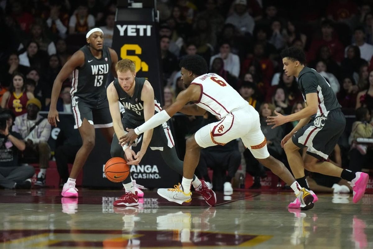 Jan 10, 2024; Los Angeles, California, USA; Washington State Cougars guard Jabe Mullins (3) and Southern California Trojans guard Bronny James (6) reach for the ball in the first half at Galen Center.