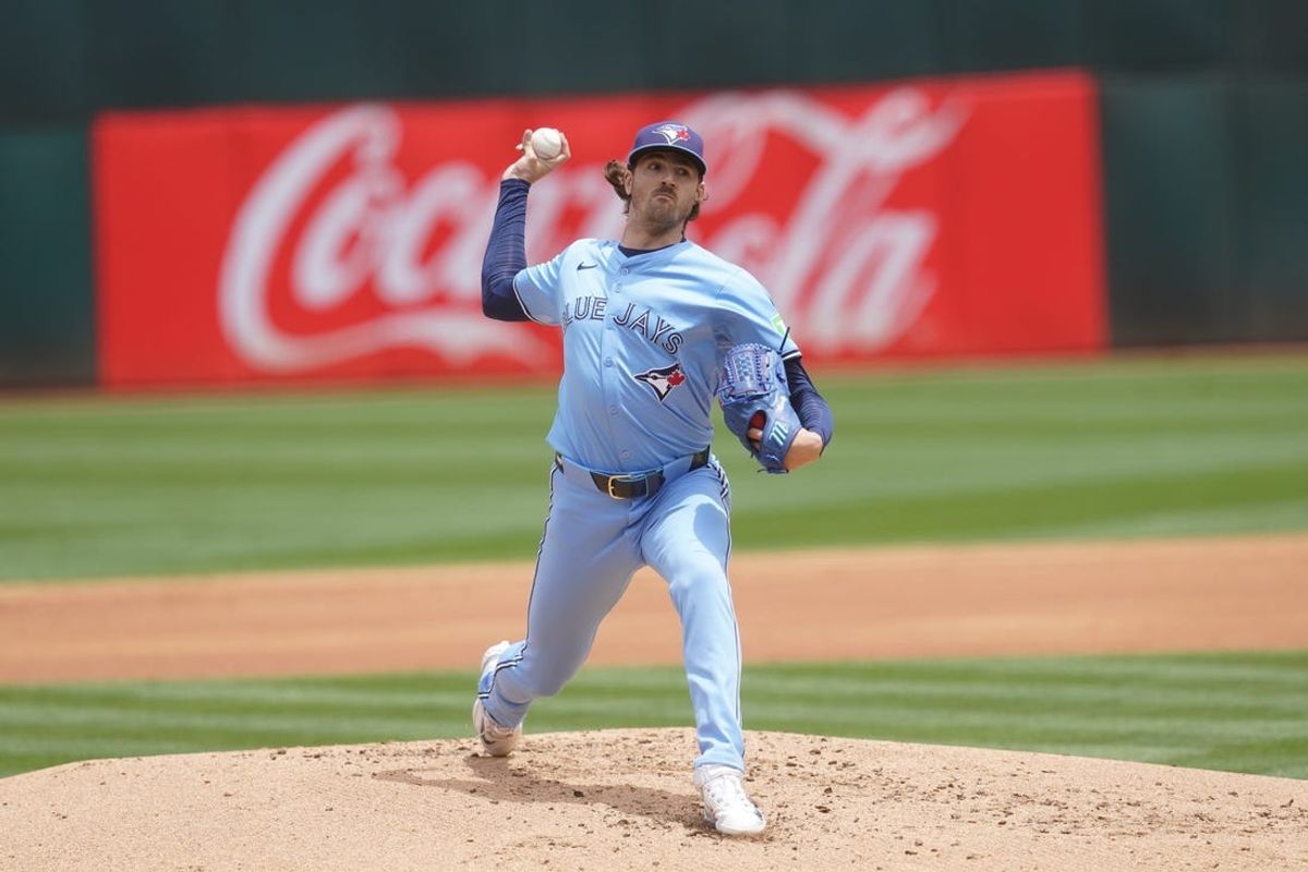 Jun 8, 2024; Oakland, California, USA; Toronto Blue Jays pitcher Kevin Gausman (34) delivers a pitch against the Oakland Athletics in the first inning at Oakland-Alameda County Coliseum. Mandatory Credit: Cary Edmondson-USA TODAY Sports
