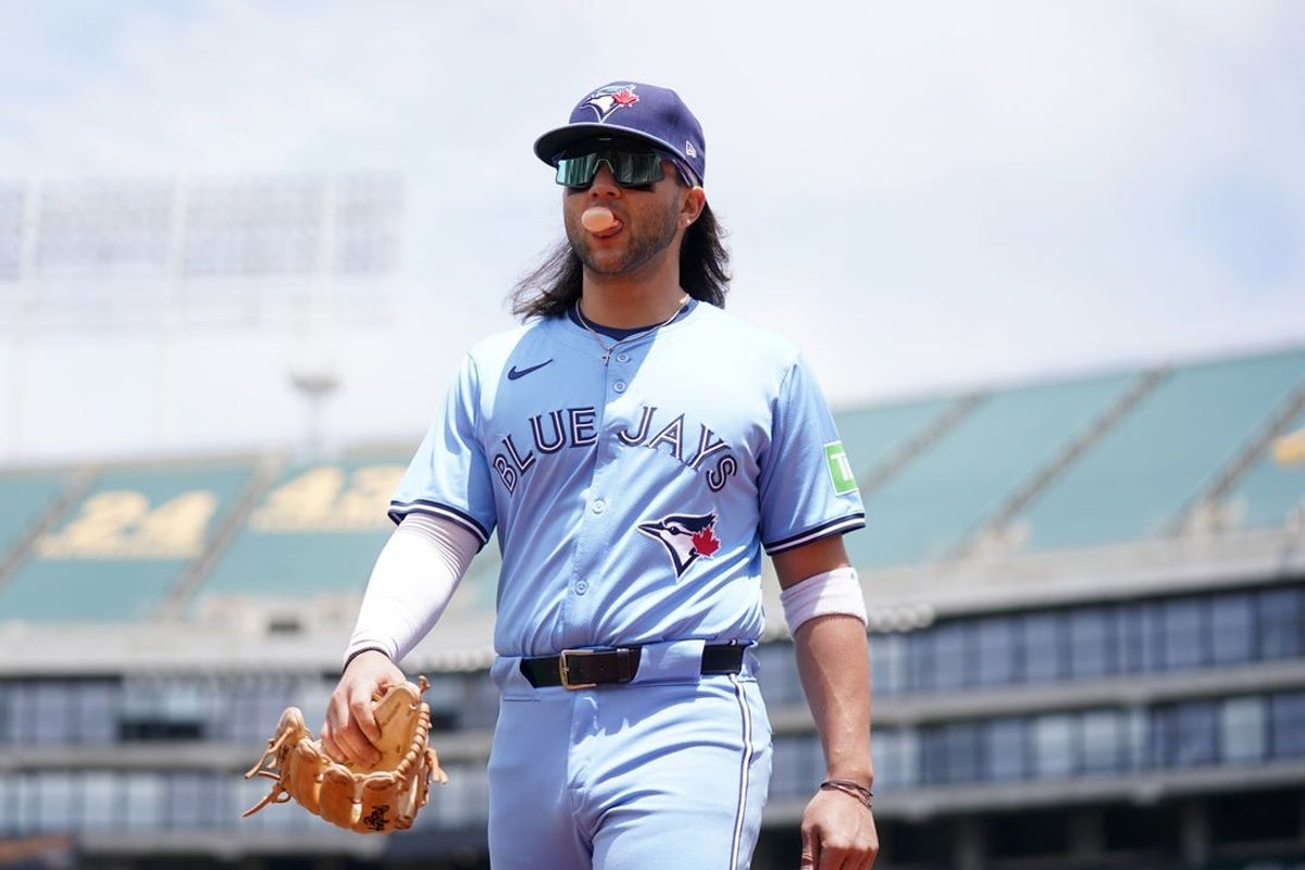 Jun 8, 2024; Oakland, California, USA; Toronto Blue Jays shortstop Bo Bichette (11) walks to the dugout before the start of the game against the Oakland Athletics at Oakland-Alameda County Coliseum. Mandatory Credit: Cary Edmondson-USA TODAY Sports