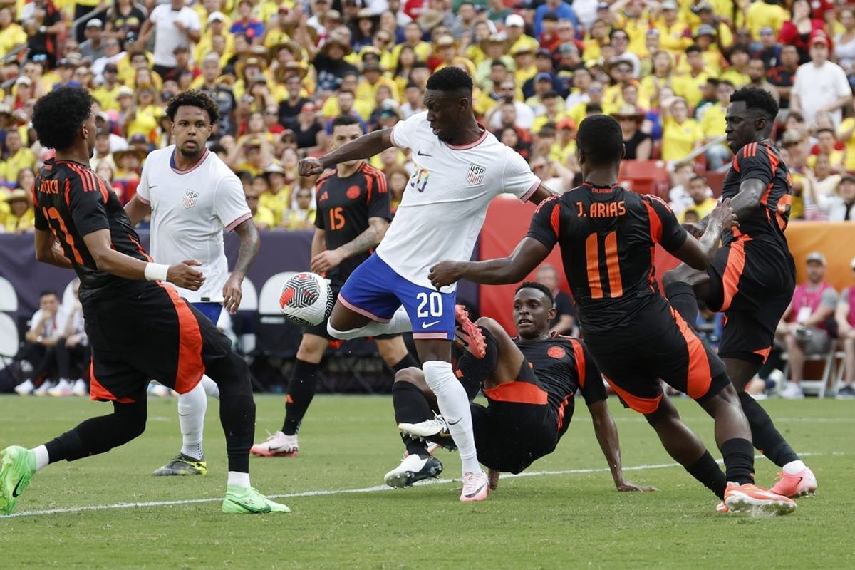 Jun 8, 2024; Landover, Maryland, USA; United States forward Folarin Balogun (20) attempts a shot on goal as Colombia midfielder Jhon Arias (11) defends in the first half at Commanders Field. Mandatory Credit: Geoff Burke-USA TODAY Sports