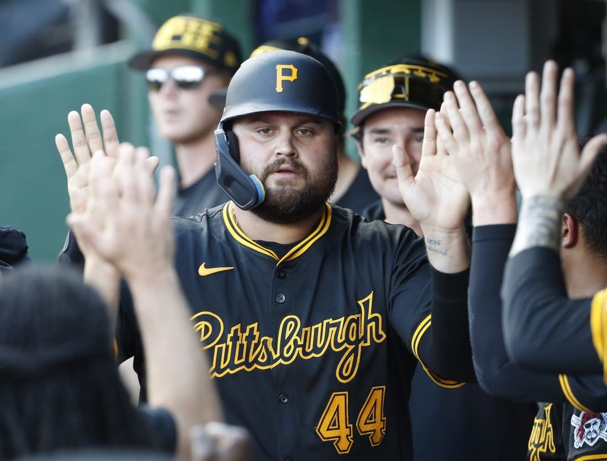 Jun 8, 2024; Pittsburgh, Pennsylvania, USA;  Pittsburgh Pirates first baseman Rowdy Tellez (44) high-fives in the dugout after scoring a run against the Minnesota Twins during the eighth inning at PNC Park. Pittsburgh won 4-0. Mandatory Credit: Charles LeClaire-USA TODAY Sports
