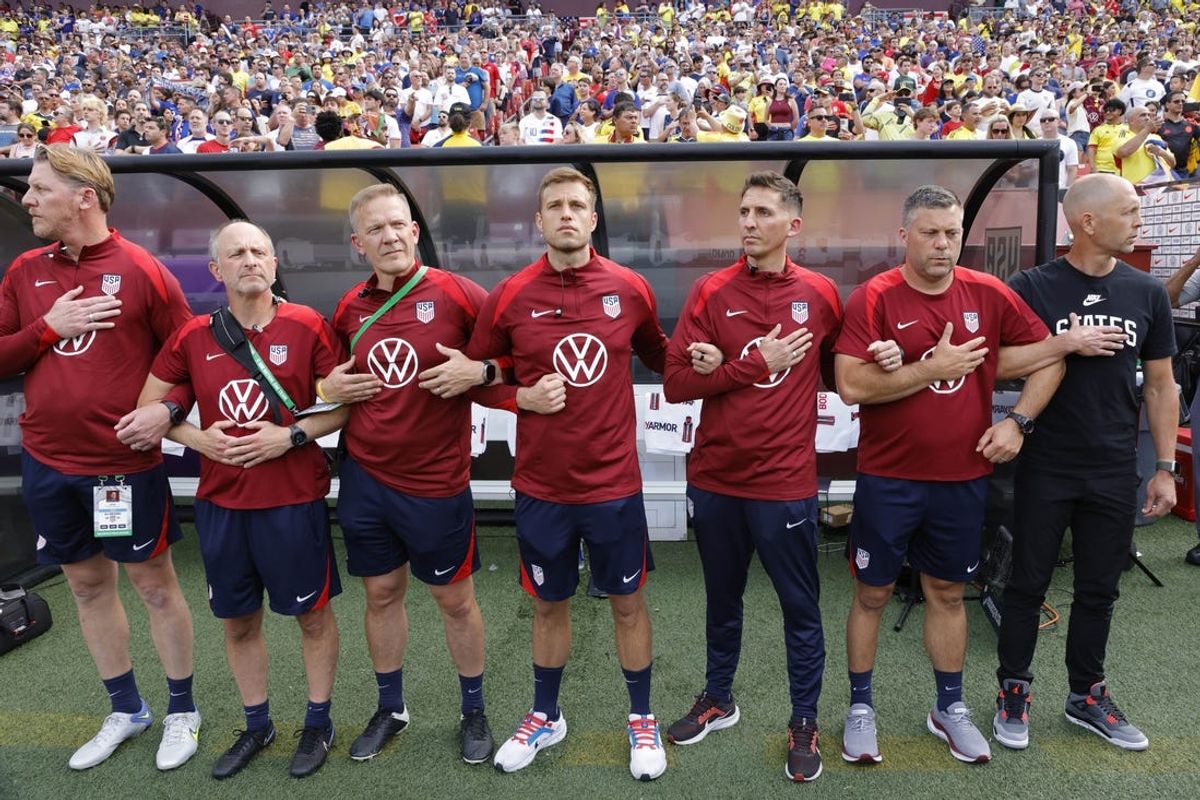 Jun 8, 2024; Landover, Maryland, USA; United States head coach Gregg Berhalter (R) stands with his staff during the national anthem prior to their friendly against Colombia at Commanders Field. Mandatory Credit: Geoff Burke-USA TODAY Sports