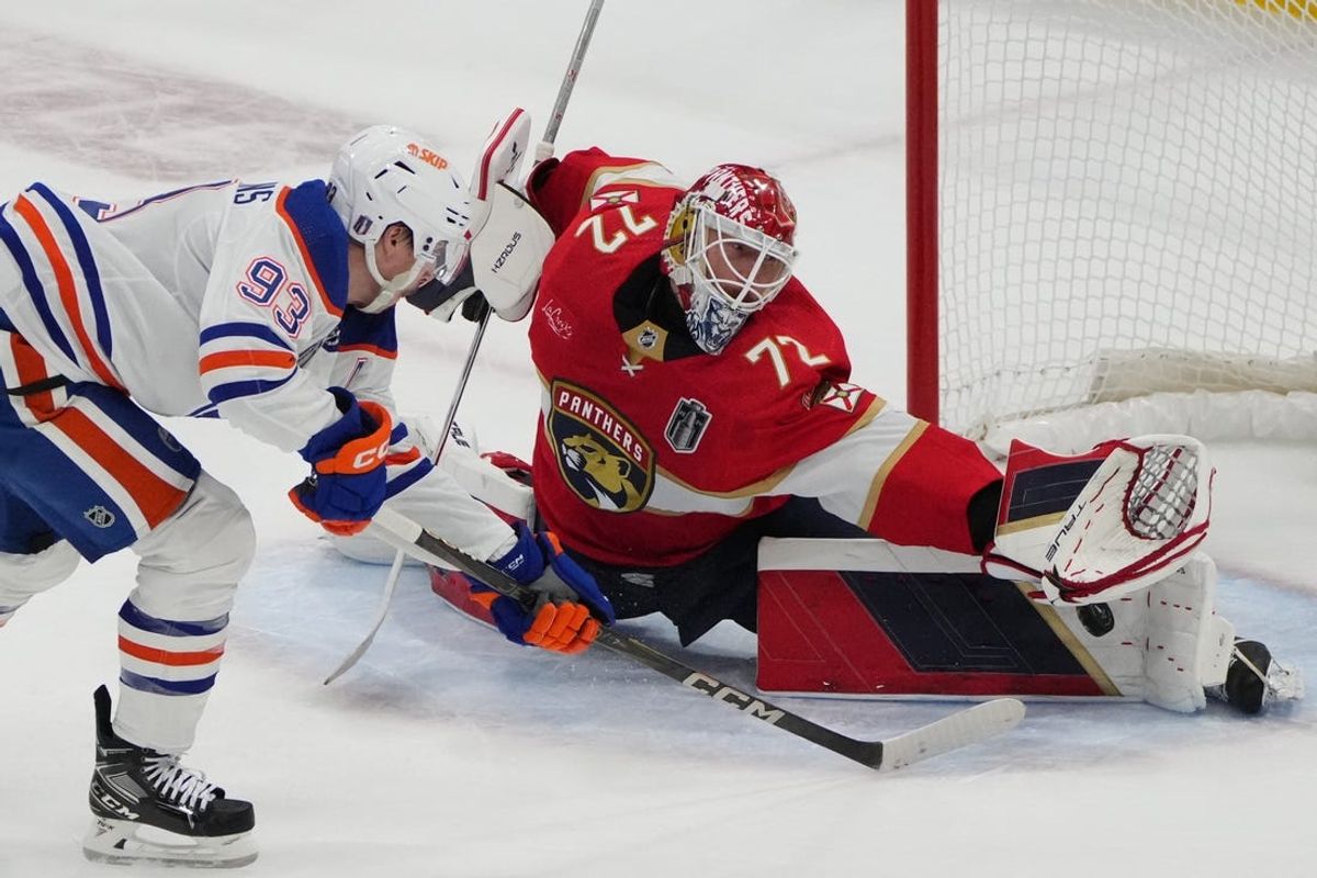 Jun 8, 2024; Sunrise, Florida, USA; Edmonton Oilers forward Ryan Nugent-Hopkins (93) shoots the puck against Florida Panthers goaltender Sergei Bobrovsky (72) during the first period  in game one of the 2024 Stanley Cup Final at Amerant Bank Arena. Mandatory Credit: Jim Rassol-USA TODAY Sports