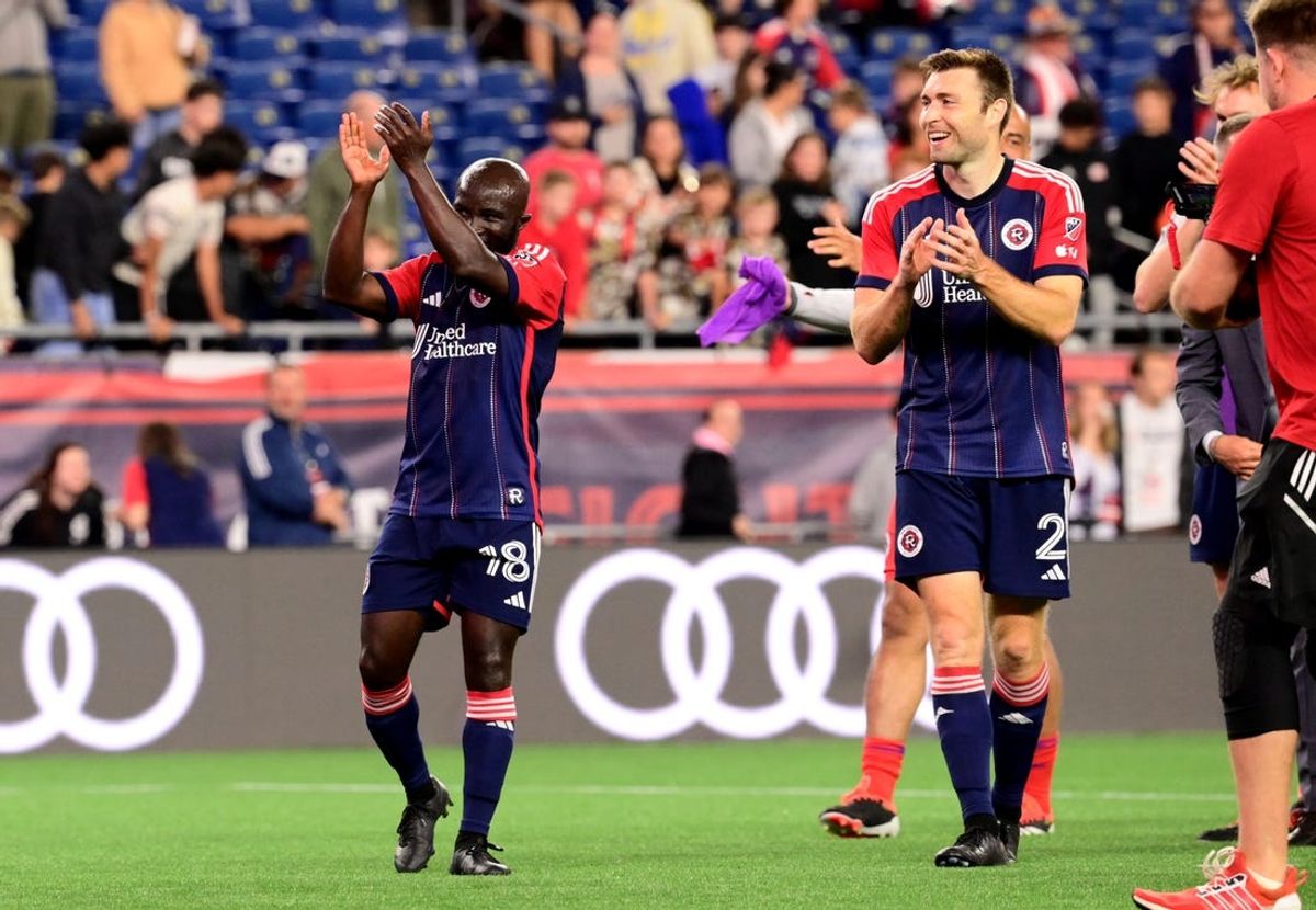 Jun 8, 2024; Foxborough, Massachusetts, USA; New England Revolution midfielder Emmanuel Boateng (18) and defender Dave Romney (2) celebrate after a game against the New York Red Bulls at Gillette Stadium. Mandatory Credit: Eric Canha-USA TODAY Sports