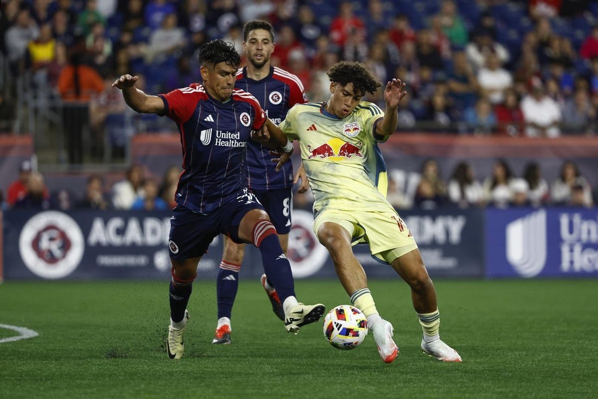 Jun 8, 2024; Foxborough, Massachusetts, USA; New England Revolution defender Xavier Arreaga (3) battles New York Red Bulls forward Julian Hall (16) for the ball during the second half at Gillette Stadium. Mandatory Credit: Winslow Townson-USA TODAY Sports