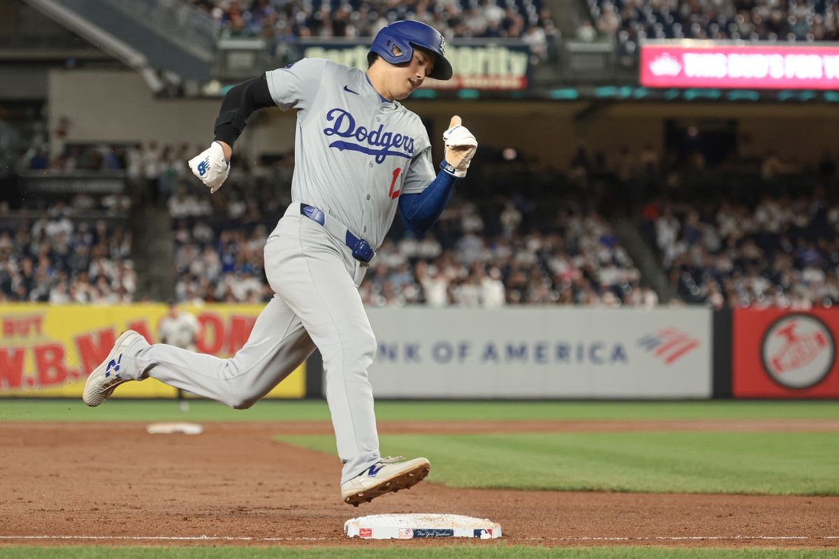 Jun 8, 2024; Bronx, New York, USA; Los Angeles Dodgers designated hitter Shohei Ohtani (17) rounds third base and scores on an double by first baseman Freddie Freeman (not pictured) during the ninth inning against the New York Yankees  at Yankee Stadium. Mandatory Credit: Vincent Carchietta-Imagn Images