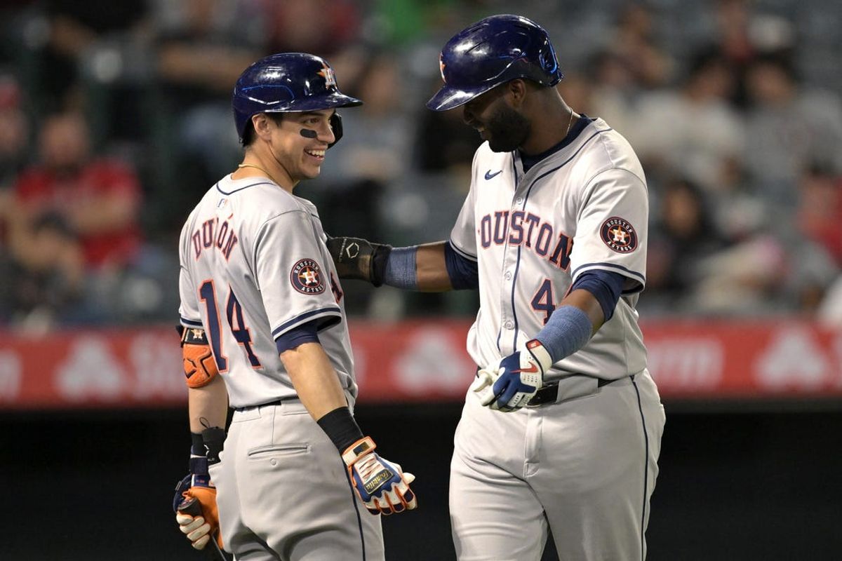Jun 8, 2024; Anaheim, California, USA;  Houston Astros designated hitter Yordan Alvarez (44) is congratulated by left fielder Mauricio Dubon (14) after scoring a run in the eighth inning against the Los Angeles Angels at Angel Stadium. Mandatory Credit: Jayne Kamin-Oncea-USA TODAY Sports