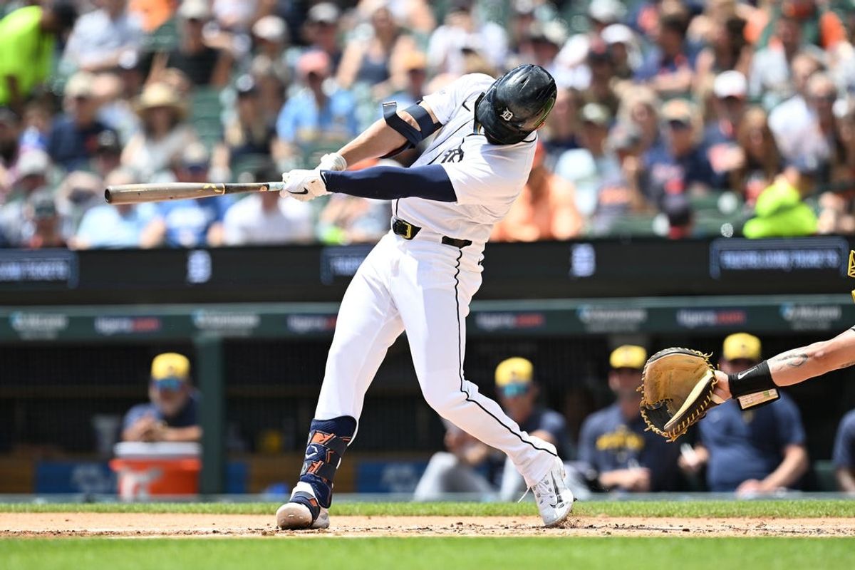 Jun 9, 2024; Detroit, Michigan, USA;  Detroit Tigers center fielder Riley Greene (31) hits an RBI double against the Milwaukee Brewers in the first inning at Comerica Park. Mandatory Credit: Lon Horwedel-USA TODAY Sports