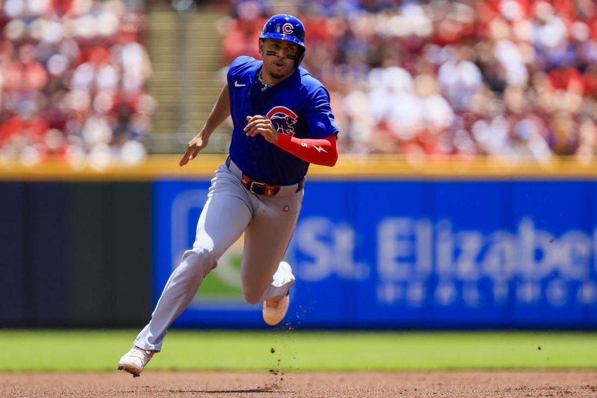 Jun 9, 2024; Cincinnati, Ohio, USA; Chicago Cubs third baseman Christopher Morel (5) scores on a three-run double hit by outfielder Ian Happ (not pictured) in the first inning against the Cincinnati Reds at Great American Ball Park. Mandatory Credit: Katie Stratman-USA TODAY Sports