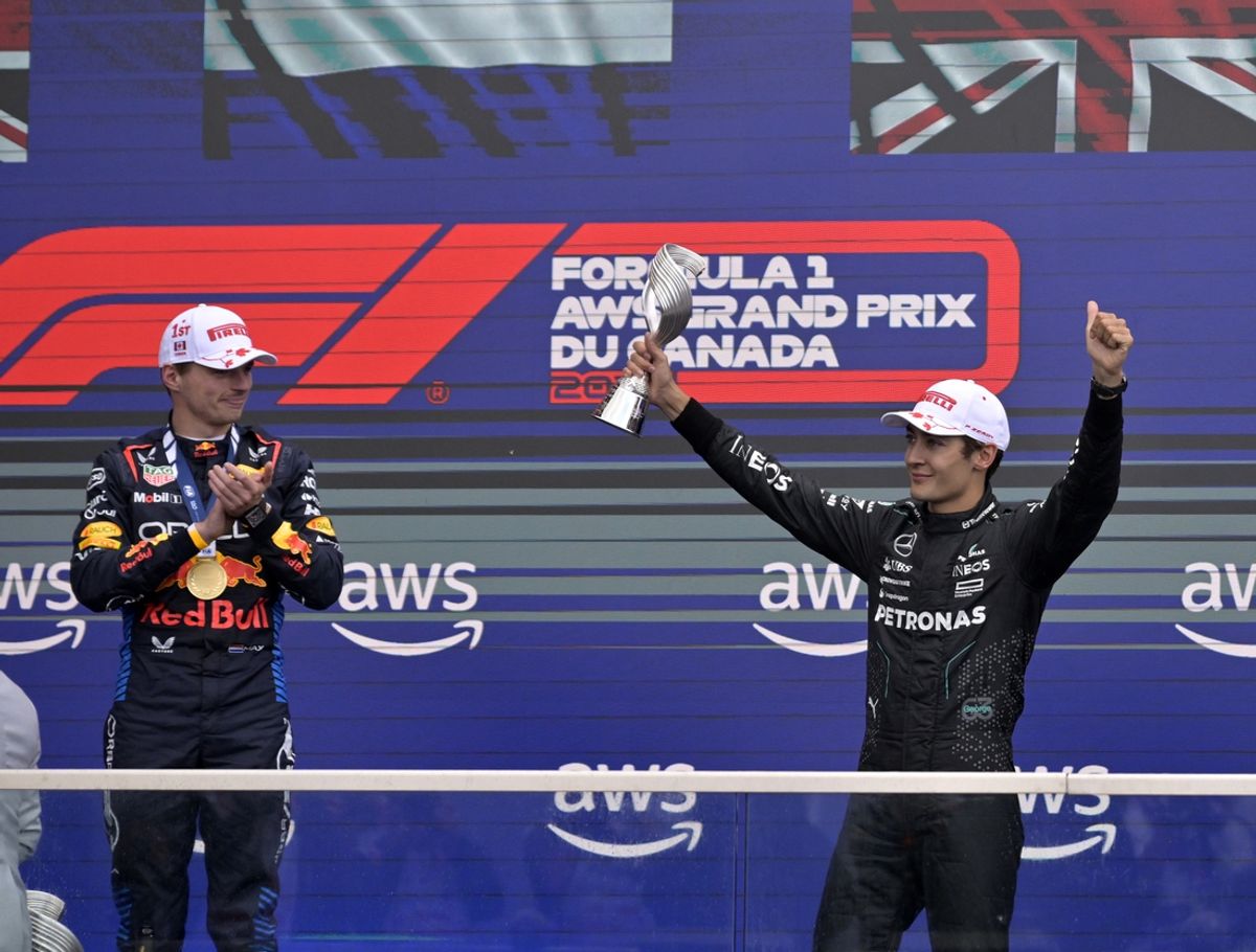 Jun 9, 2024; Montreal, Quebec, CAN;  Mercedes driver George Russell (GBR) reacts next to winner Red Bull Racing driver Max Verstappen (NED) after getting third place in the Canadian Grand Prix at Circuit Gilles Villeneuve. Mandatory Credit: Eric Bolte-Imagn Images