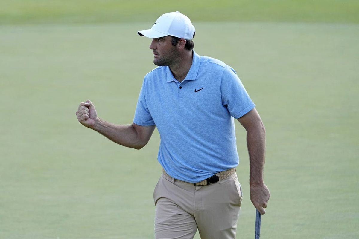 Jun 9, 2024; Dublin, Ohio, USA; Scottie Scheffler reacts after making a putt on the 16th green during the final round of the Memorial Tournament at Muirfield Village Golf Club. Mandatory Credit: Adam Cairns-USA TODAY Sports