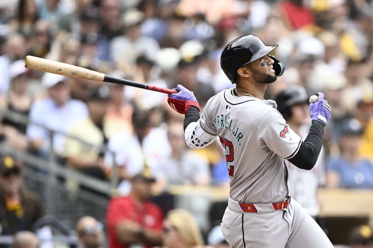 Jun 9, 2024; San Diego, California, USA; Arizona Diamondbacks left fielder Lourdes Gurriel Jr. (12) hits a single during the fourth inning against the San Diego Padres at Petco Park. Mandatory Credit: Denis Poroy-USA TODAY Sports at Petco Park.