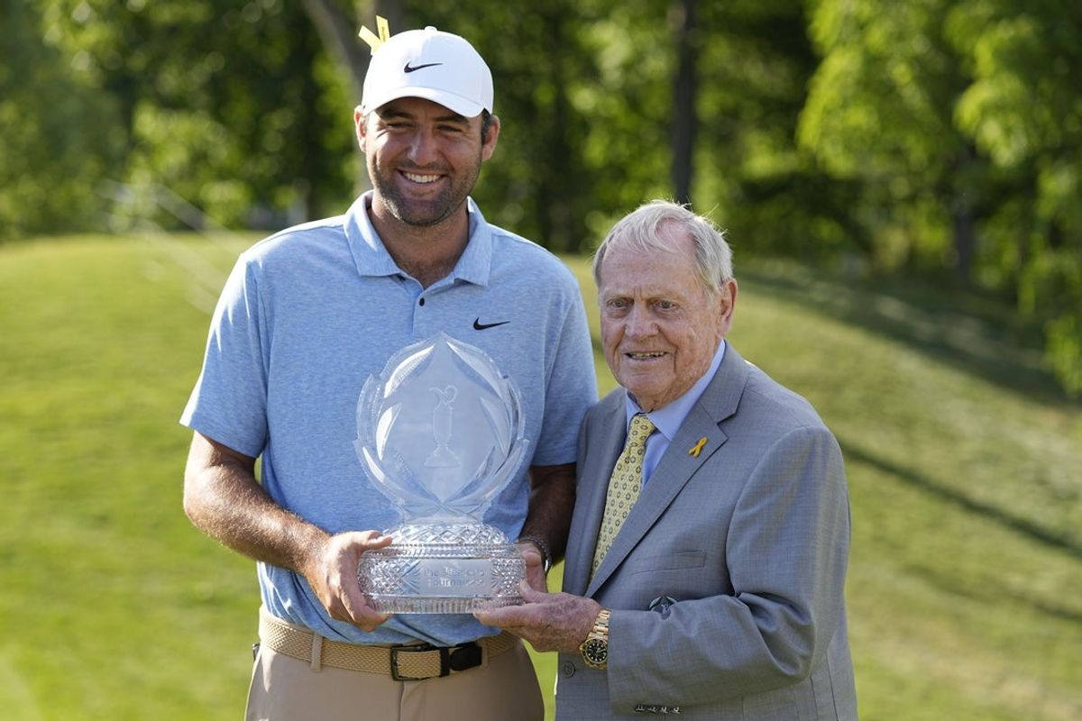 Jun 9, 2024; Dublin, Ohio, USA; Scottie Scheffler (left) poses with the trophy with retired golfer Jack Nicklaus (right) after winning the Memorial Tournament at Muirfield Village Golf Club. Mandatory Credit: Adam Cairns-Imagn Images