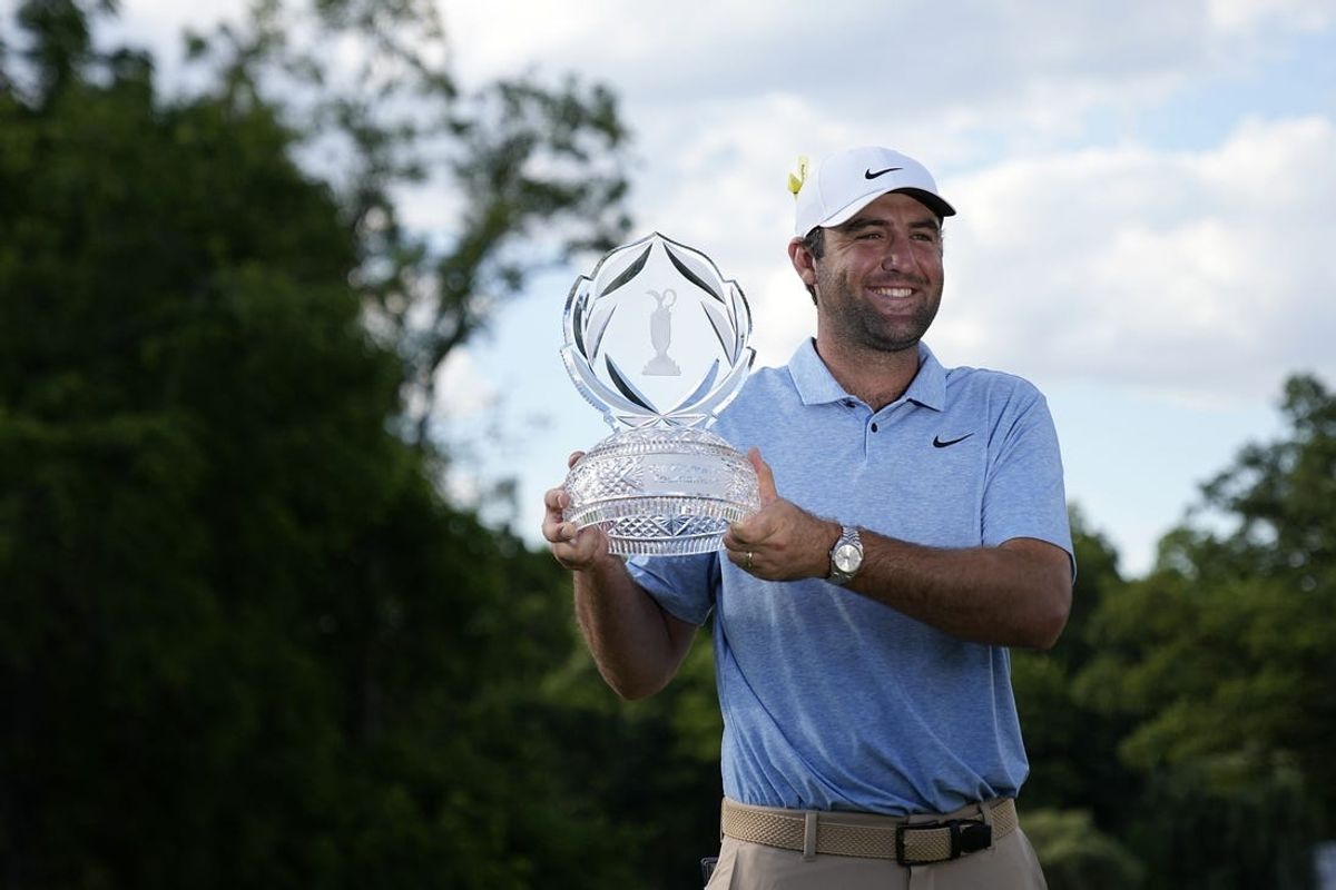 Jun 9, 2024; Dublin, Ohio, USA; Scottie Scheffler poses for a photograph with the trophy for the Memorial Tournament at Muirfield Village Golf Club. Mandatory Credit: Adam Cairns-USA TODAY Sports