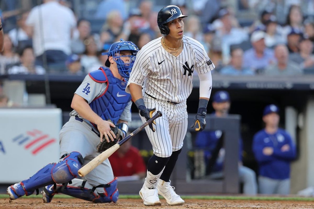 Jun 9, 2024; Bronx, New York, USA; New York Yankees third baseman Oswaldo Cabrera (95) watches his solo home run against the Los Angeles Dodgers during the third inning at Yankee Stadium. Mandatory Credit: Brad Penner-USA TODAY Sports