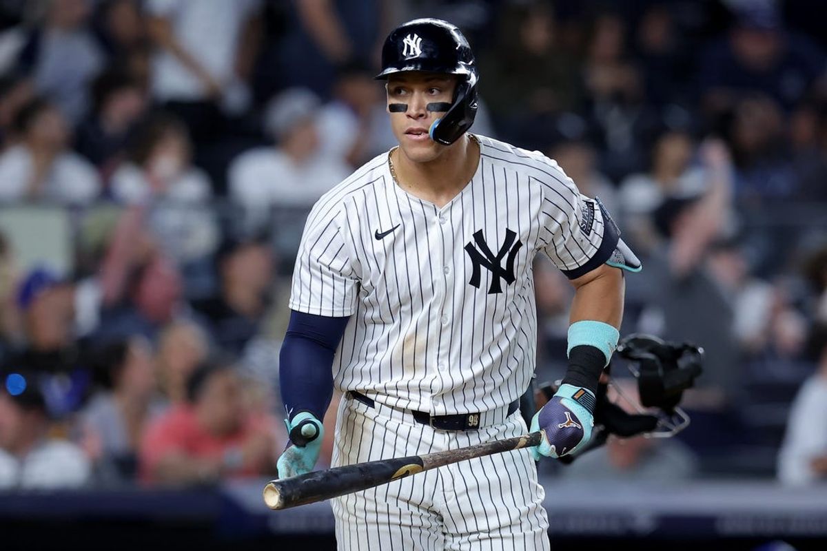 Jun 9, 2024; Bronx, New York, USA; New York Yankees right fielder Aaron Judge (99) reacts after hitting a solo home run against the Los Angeles Dodgers during the eighth inning at Yankee Stadium. Mandatory Credit: Brad Penner-USA TODAY Sports