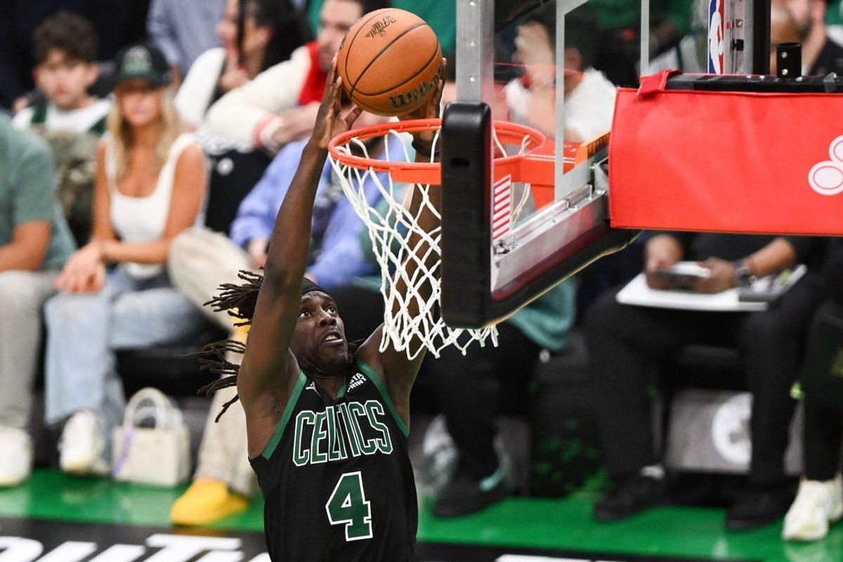 Jun 9, 2024; Boston, Massachusetts, USA; Boston Celtics guard Jrue Holiday (4) dunks and scores against the Dallas Mavericks during the second half of game two of the 2024 NBA Finals at the TD Garden. Mandatory Credit: USA TODAY Sports Images