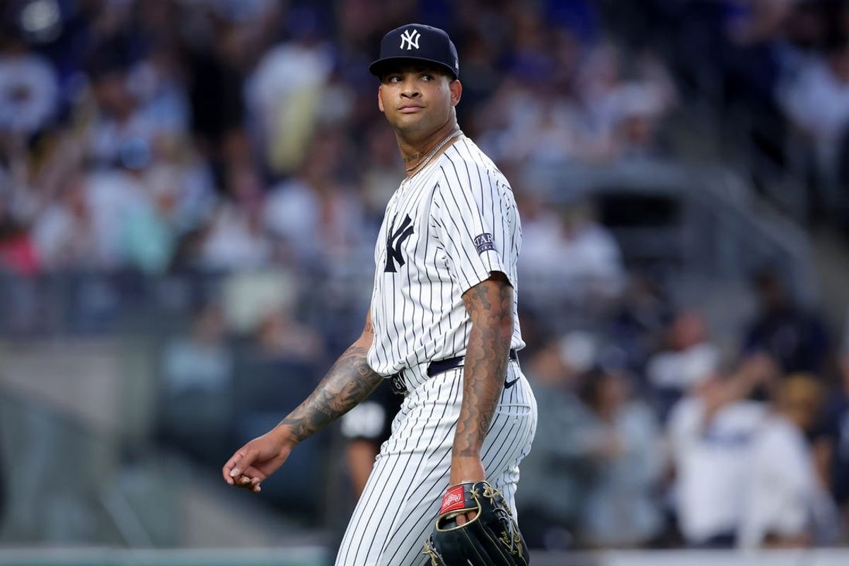Jun 9, 2024; Bronx, New York, USA; New York Yankees starting pitcher Luis Gil (81) reacts during the fifth inning against the Los Angeles Dodgers at Yankee Stadium. Mandatory Credit: Brad Penner-USA TODAY Sports
