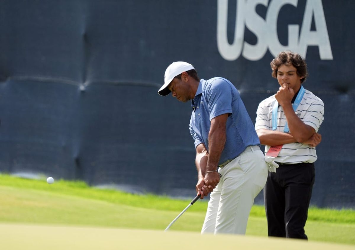 Jun 10, 2024; Pinehurst, North Carolina, USA; Tiger Woods chips up onto the 18th green during a practice round for the U.S. Open golf tournament at Pinehurst No. 2. Mandatory Credit: Katie Goodale-USA TODAY Sports